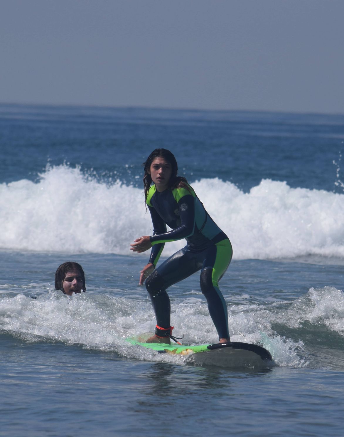 new student paddling in the water